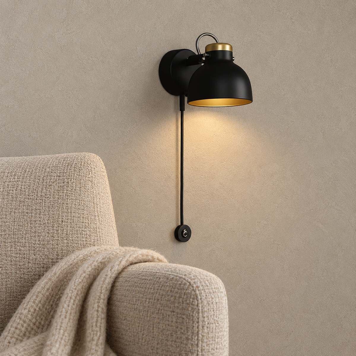 Miralote black wall lamp glowing beside an oatmeal reading chair in a sunlit library