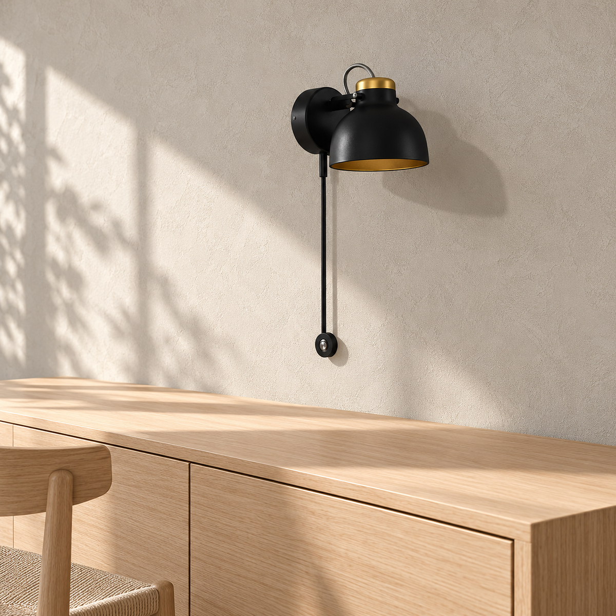 Miralote black wall sconce unlit above a clear sideboard in a bright dining room