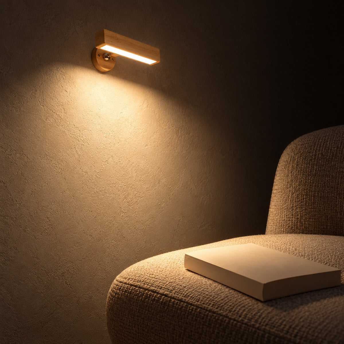 Mirsavel natural wall light aimed onto a reading chair in a study corner at night