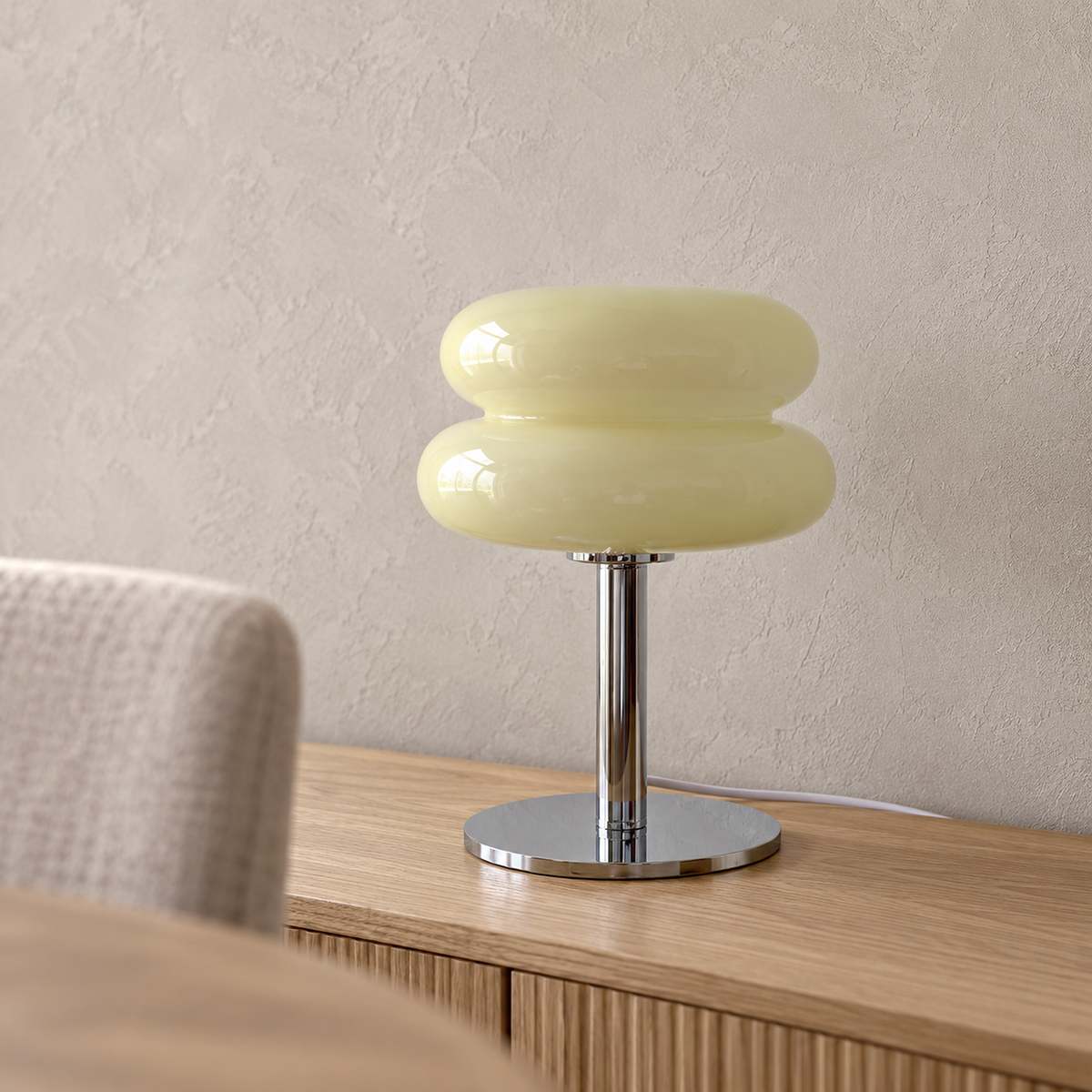 Misolen cream table lamp close up of the rounded stained glass shade and silver colored body
