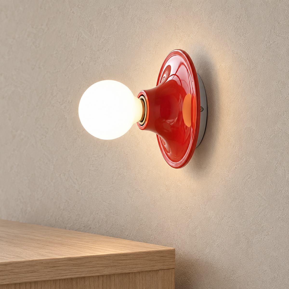 Monterla red plug in wall light glowing above an entryway console in daylight