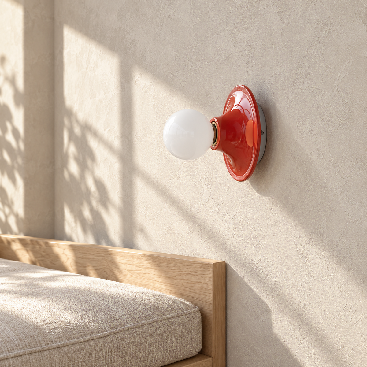 Monterla red wall light switched off beside a breakfast nook bench