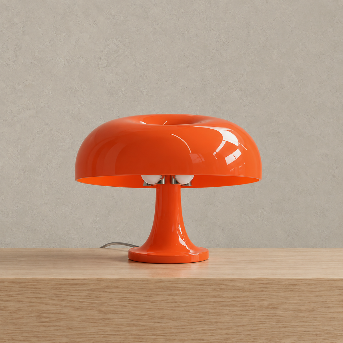 Moranel orange mushroom table lamp shown unlit on a pale surface with its round plastic shade