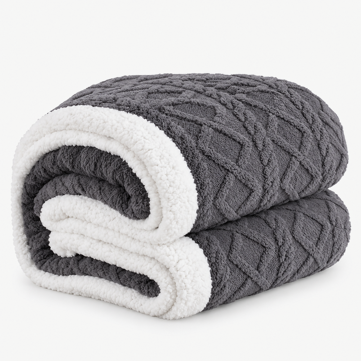 Mosilen reversible sherpa fleece blanket in charcoal and white, loosely folded on a white background