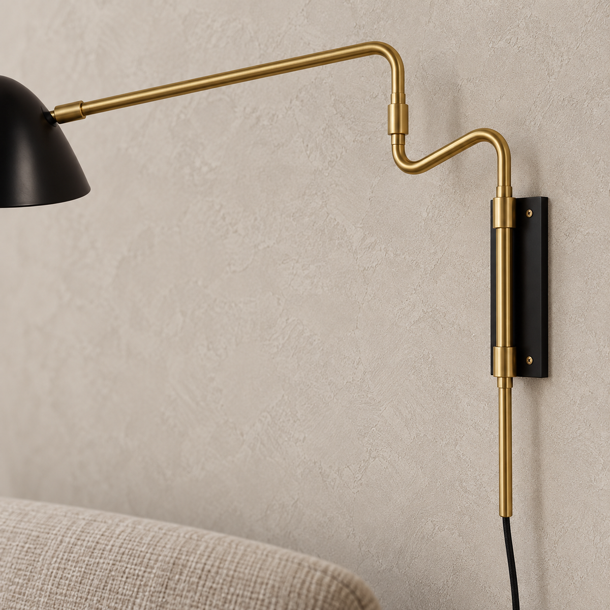 Movresa black bedside wall light showing the narrow backplate and gold arm joint