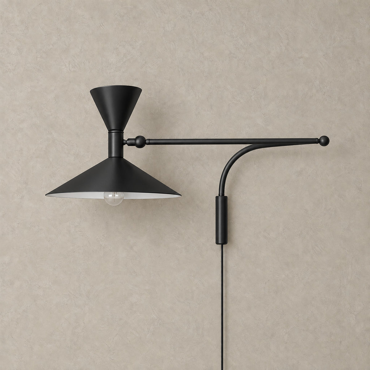 Nalveto black plug in wall sconce shown unlit, with a swing arm and double cone metal shade #color_black