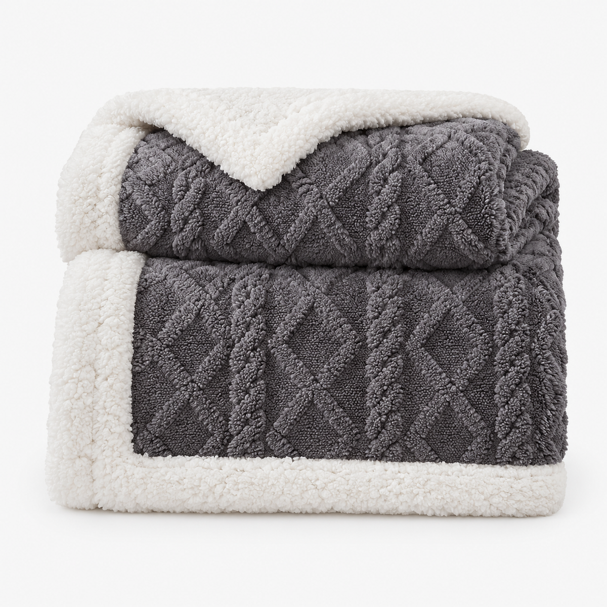 Narelvo charcoal sherpa fleece blanket loosely folded on a white background showing its raised geometric pattern