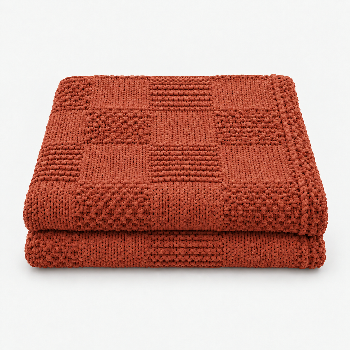 Nelvari red checkered knit throw blanket loosely folded on a plain white background