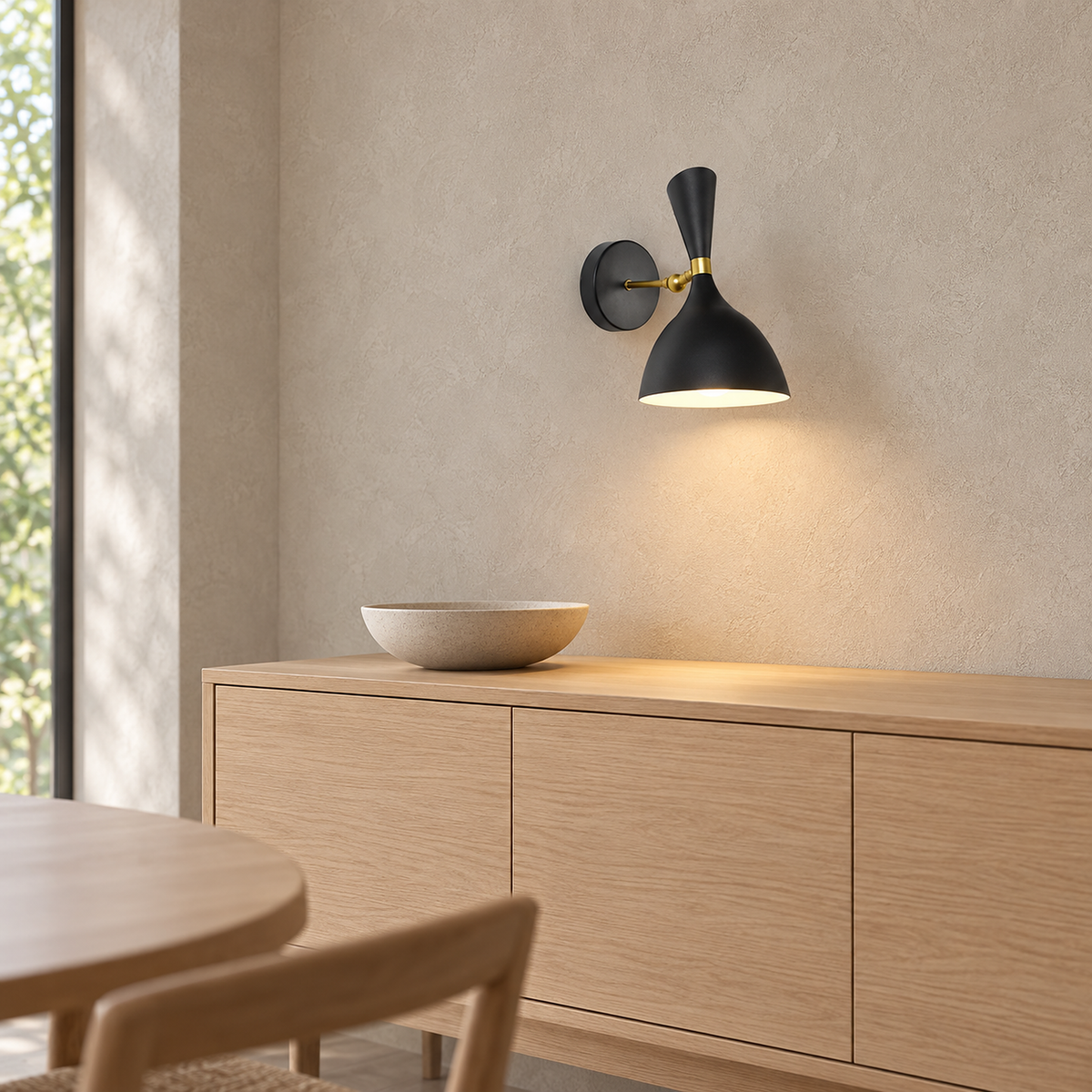 Nematore black wall lamp glowing above a sideboard in a dining room #color_black