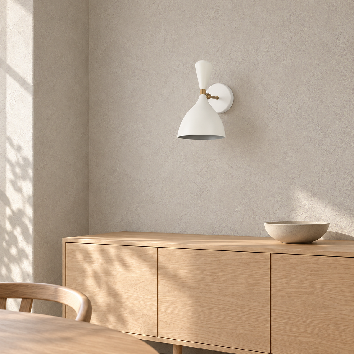 Nematore white wall light unlit in daylight above dining room furniture