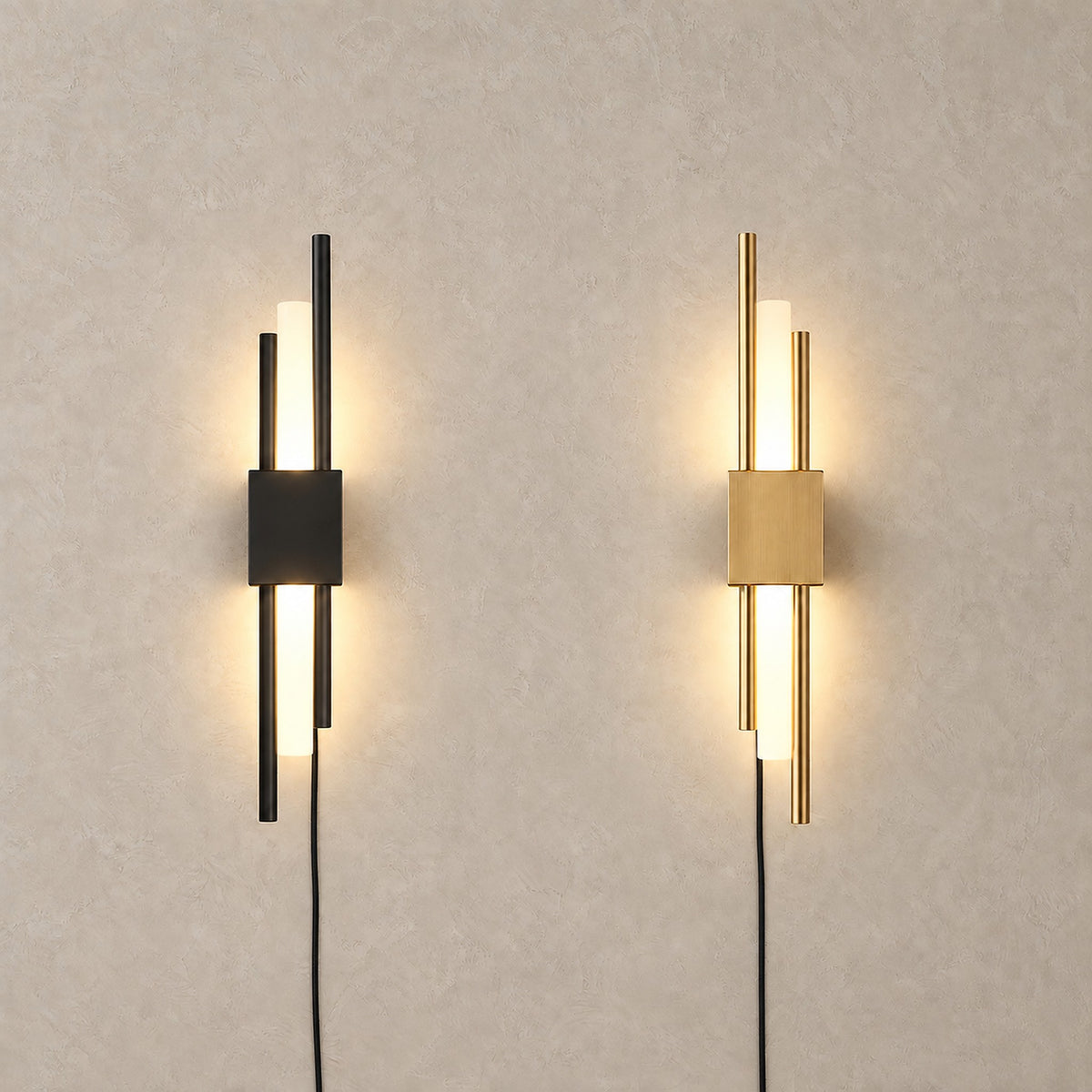 Nemirsa black and gold plug in wall lights side by side, both lit, comparing the two finishes