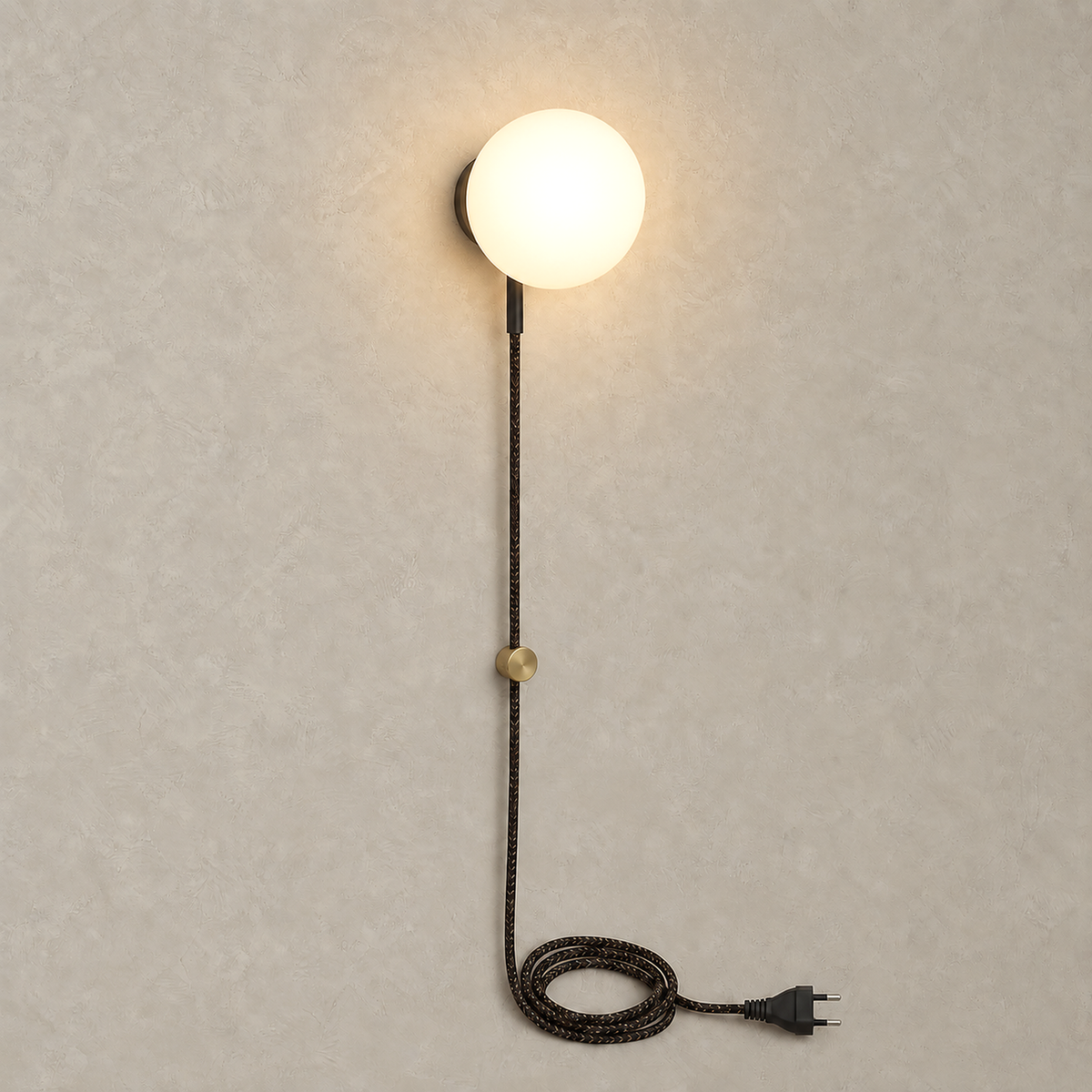 Neravolo black wall sconce glowing with its frosted glass globe against warm greige plaster
