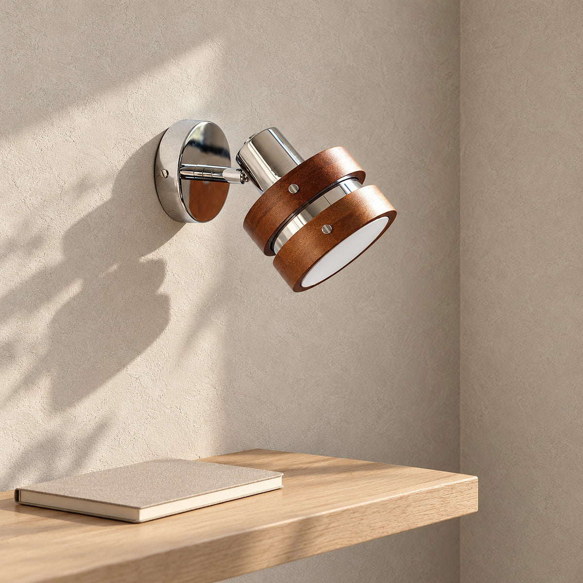 Nerilvo chrome and walnut wall sconce unlit beside a wall ledge in a study nook