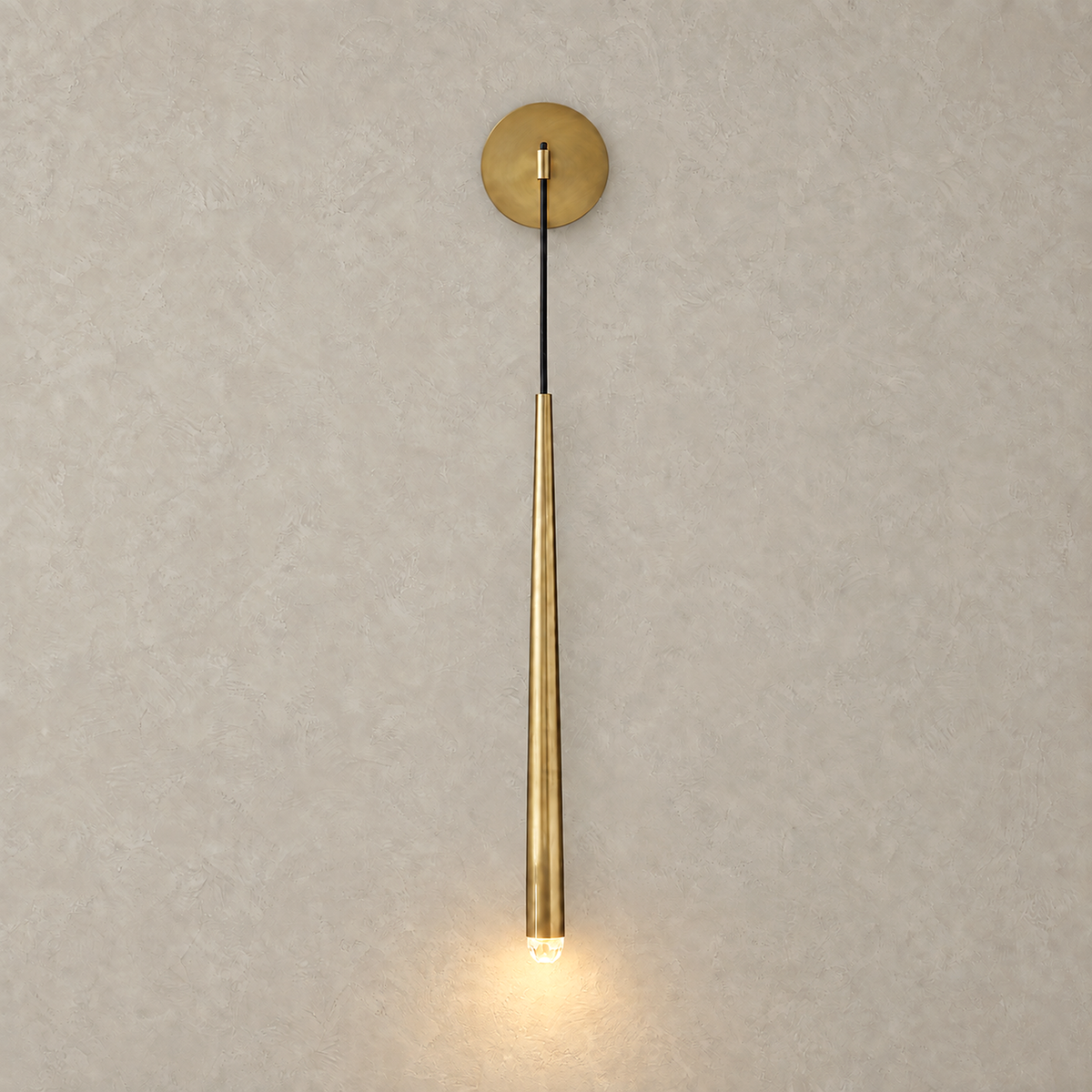 Nerisavo polished brass wall sconce shown as a lit pair against a plain backdrop