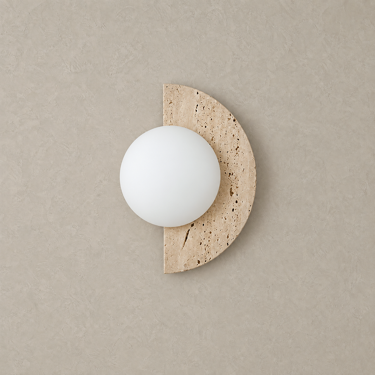 Nevaline beige and white wall sconce unlit showing its half moon travertine backplate