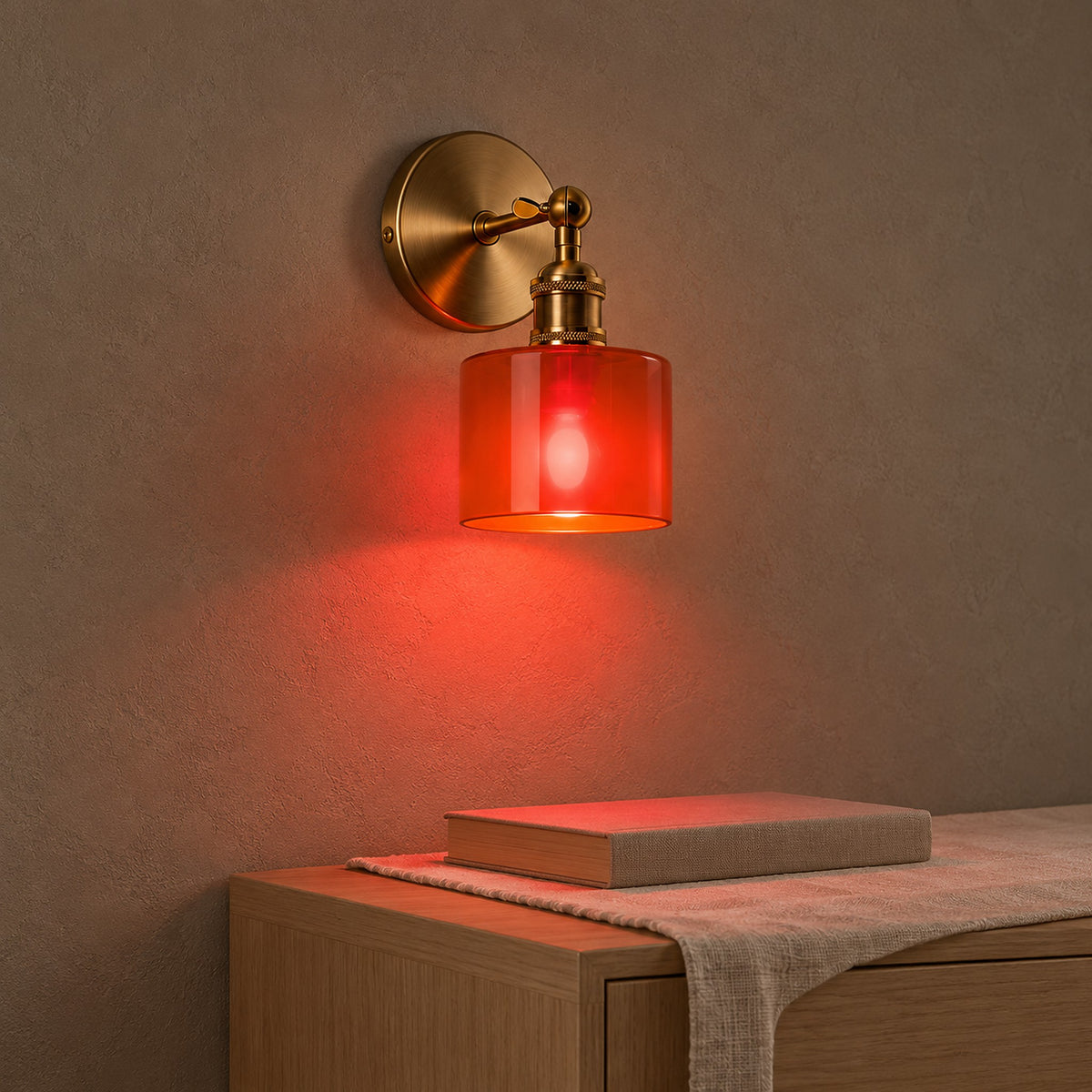 Nevalto orange wall sconce casting colored light downward over a dining room wall