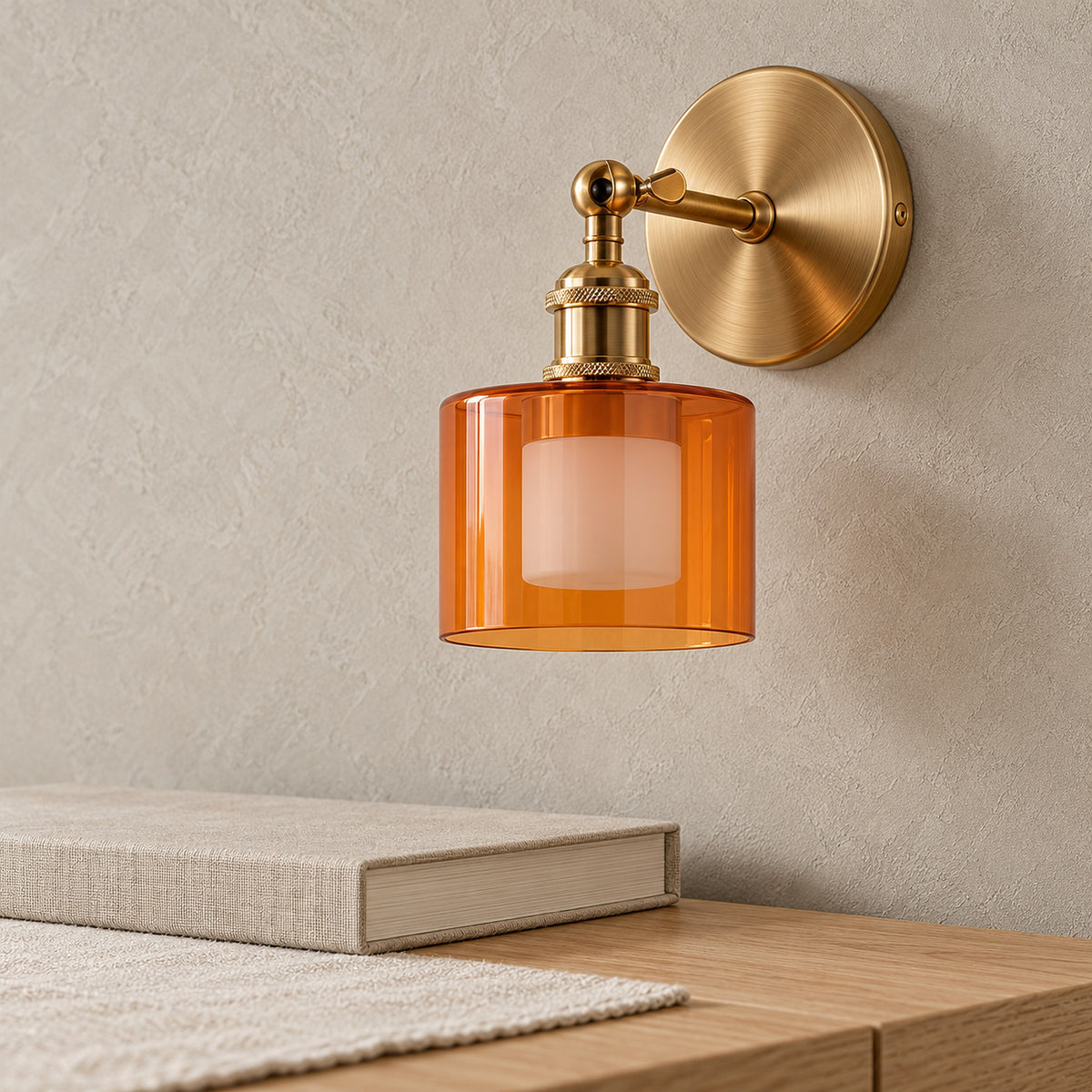 Nevalto orange wall sconce close up of the glass shade and plated metal finish in a dining room