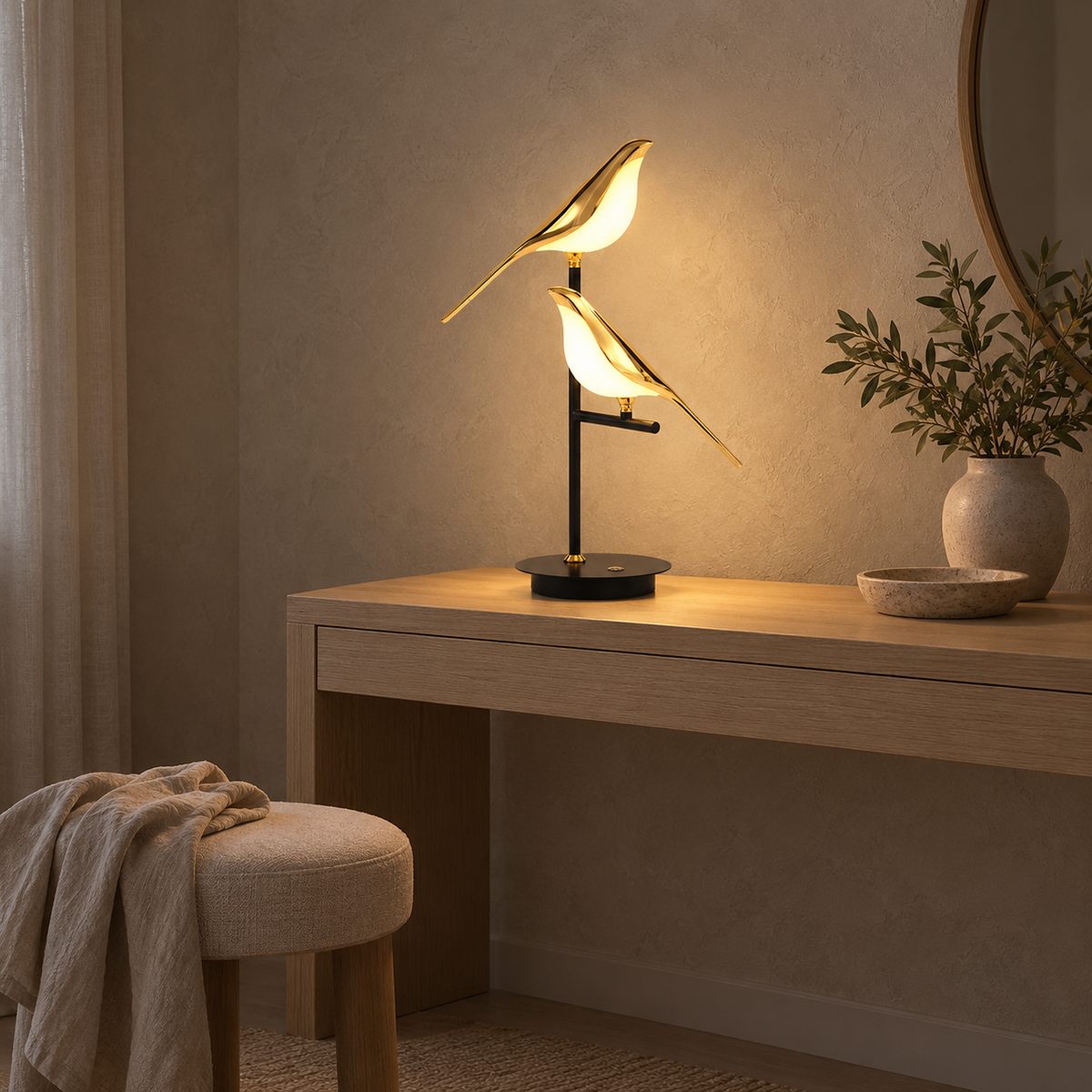 Nirelta black and gold bedside lamp lit in a dressing room in the afternoon