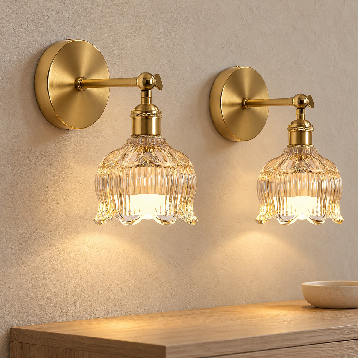 Pair of Nolavire golden cordless wall lamps glowing above an entryway console in soft daylight