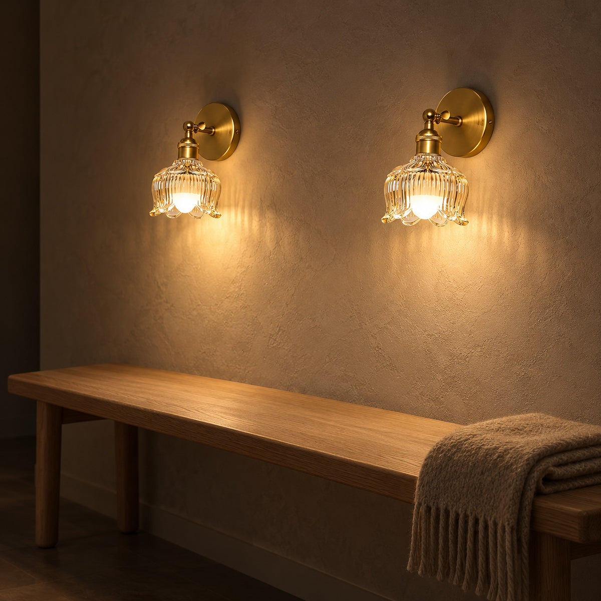 Pair of Nolavire golden cordless wall lights casting warm light along a hallway at night