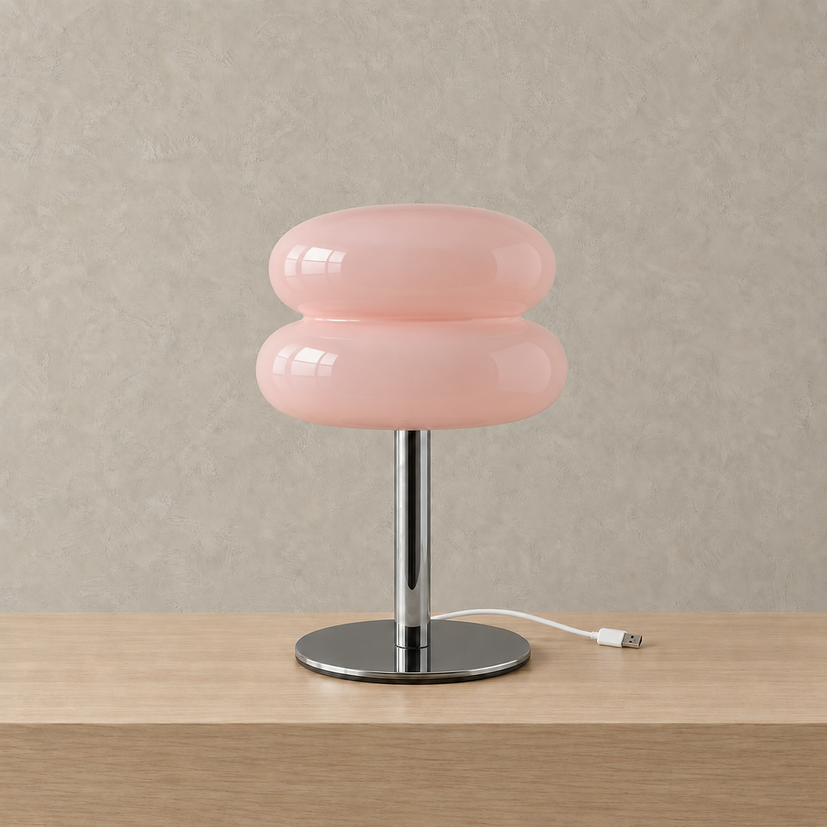 Olimena bedside lamp in blush, unlit with glossy glass and a reflective polished iron base #color_blush