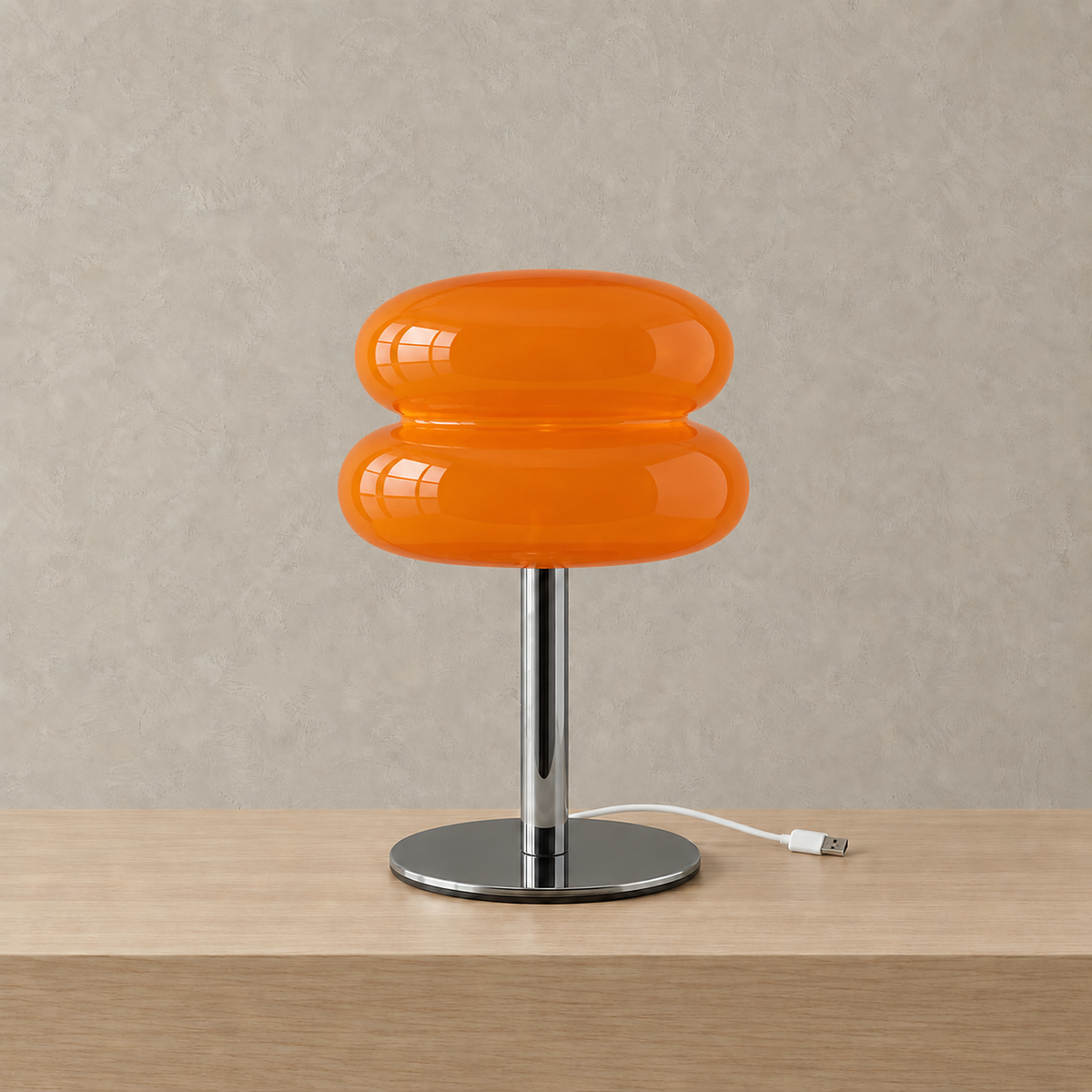 Olimena table lamp in orange, unlit to show the glossy glass shade and polished iron base #color_orange