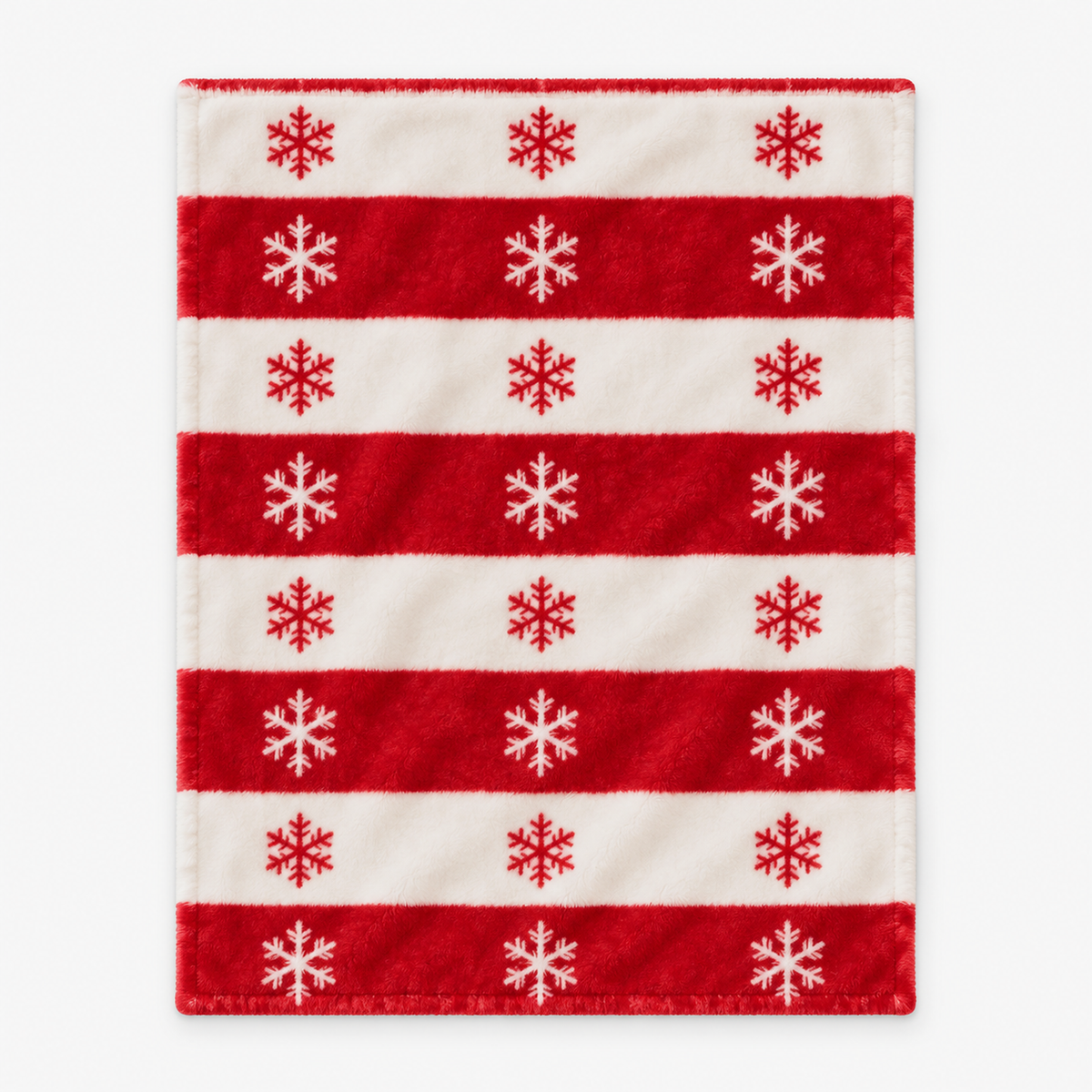 Olmarin striped snowflake christmas flannel throw blanket in red and white laid open on a white background