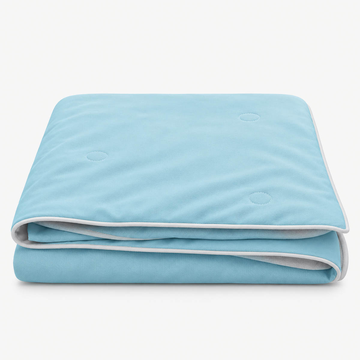 Ormivel sky blue reversible cooling blanket loosely folded on a white background
