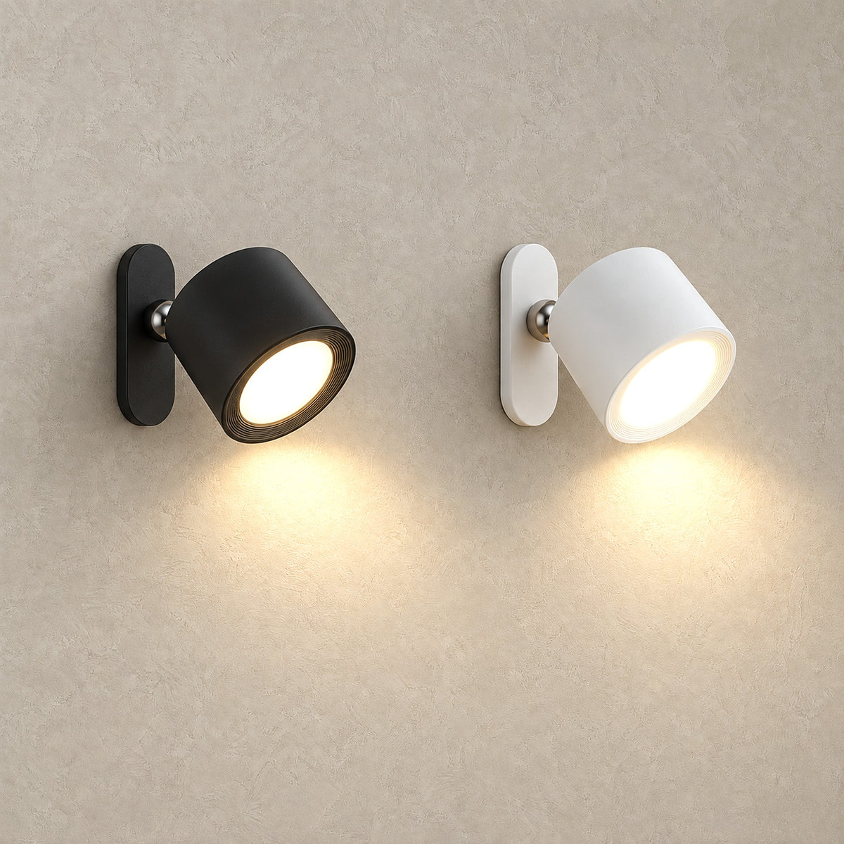 Orsilen black and white wall lamps shown together, both lit side by side