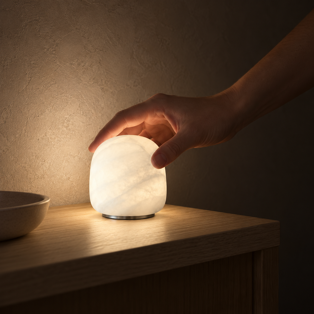 Ravelmo white battery operated table lamp lighting an entryway console at night