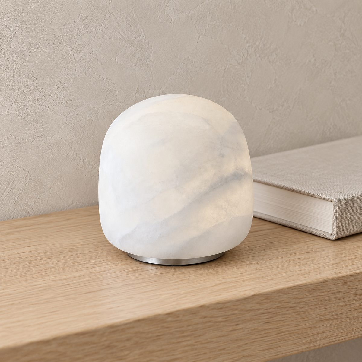 Ravelmo white table lamp in close up, showing the cloudy body of this small rechargeable lamp