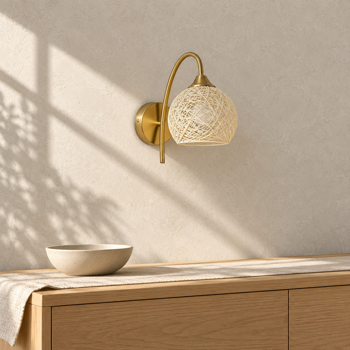 Remilvo gold cordless wall lamp unlit above a sideboard in a bright dining room