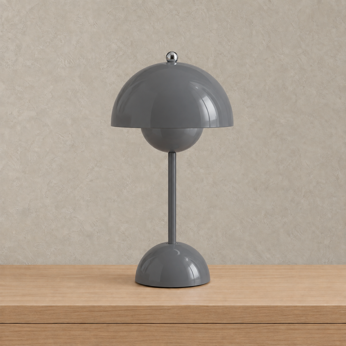 Retomira gray bedside lamp unlit with its glossy domed shade facing forward #color_gray
