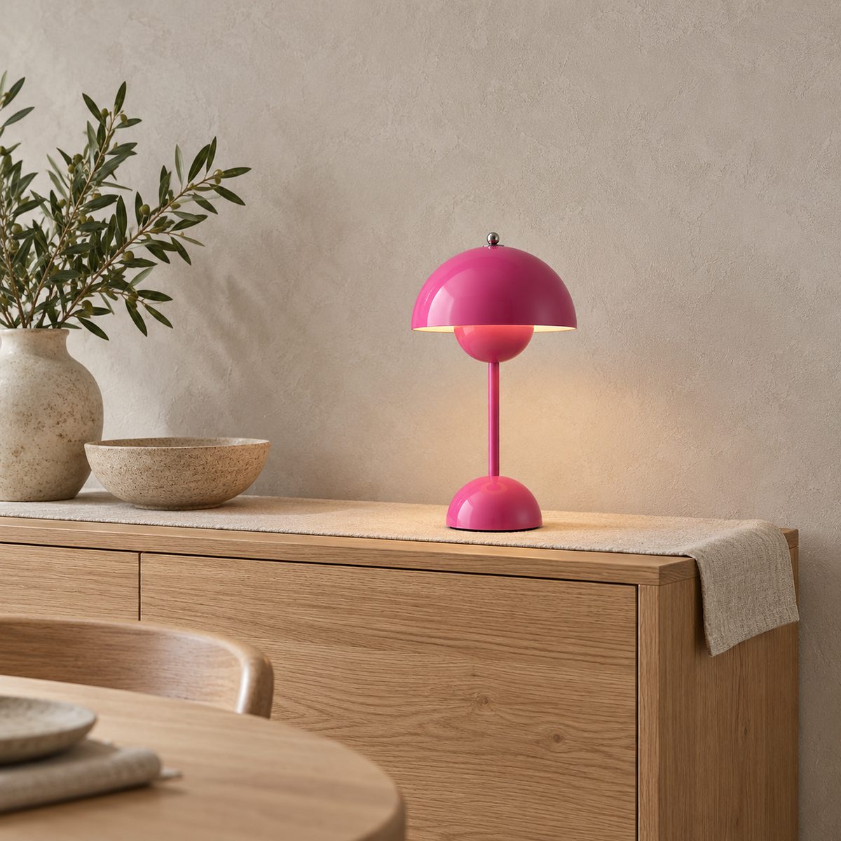 Retomira pink battery operated table lamp set on a quiet dining sideboard #color_pink