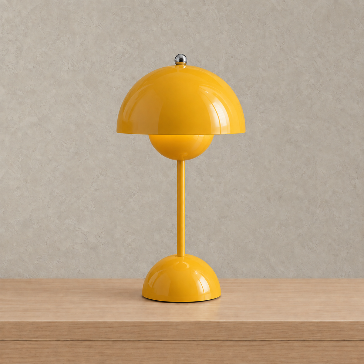 Retomira yellow portable table lamp with its glossy dome switched off #color_yellow