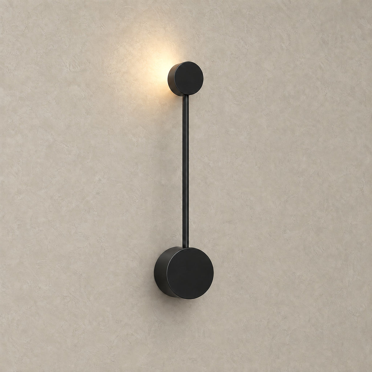 Rilameo black wall lamp casting a warm indirect glow on the wall behind it