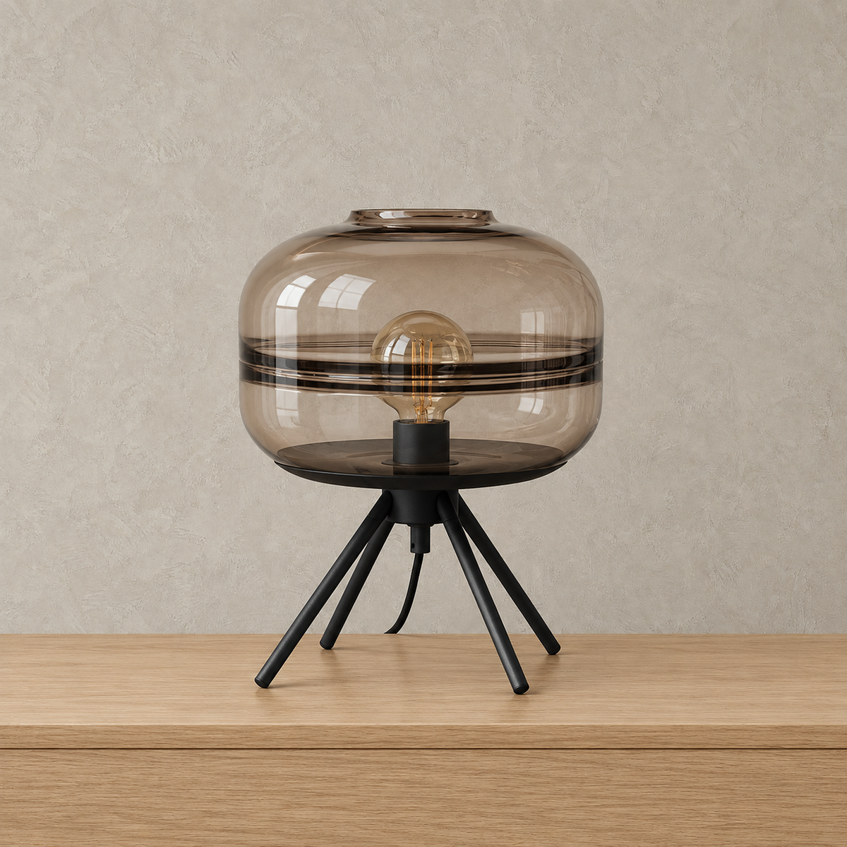 Rimacel glass table lamp in light brown tinted glass with a metal body, shown unlit on a pale tabletop