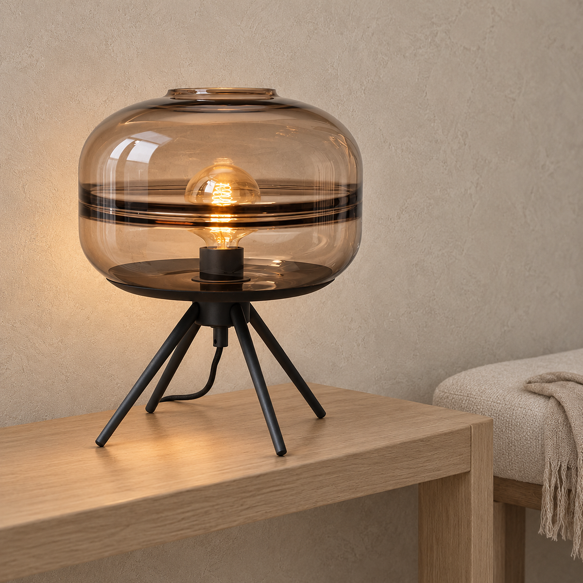 Rimacel light brown glass table lamp glowing on an entryway console in soft daylight