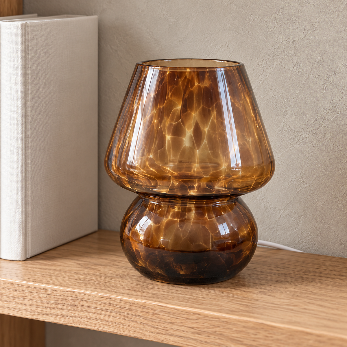 Rimelota brown mushroom table lamp close up of the speckled glass shade, unlit in a daylit library