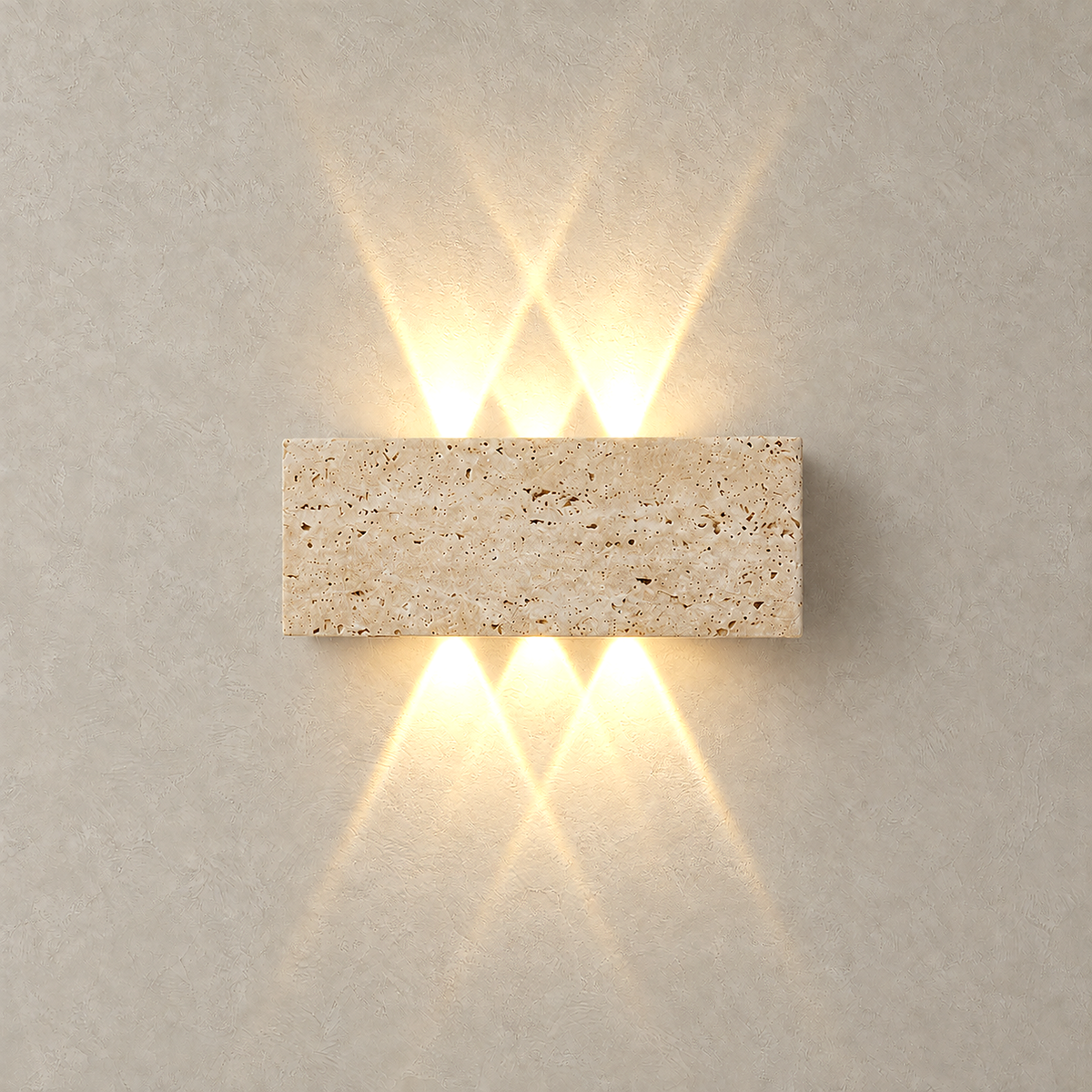 Sarivol beige stone hardwired wall light switched on, narrow warm beams crossing above and below the stone