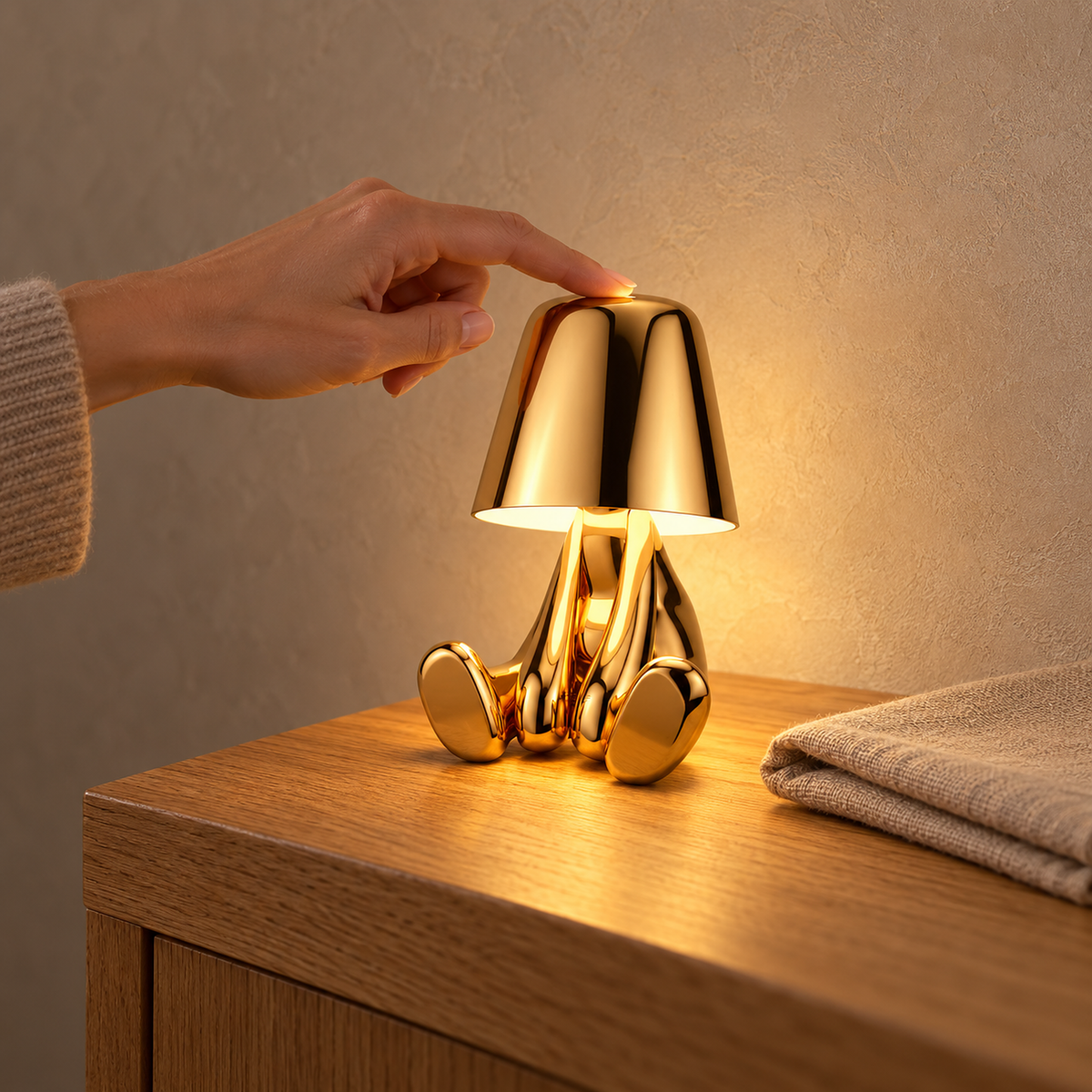 Sarovel gold cordless table lamp glowing on the corner of a sideboard in a dining room