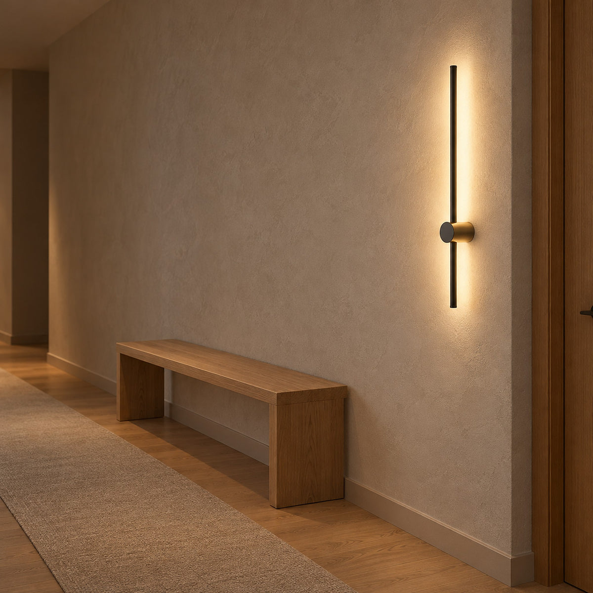 Semarlo black and gold wall sconce, a slim lit bar beside a hallway doorway