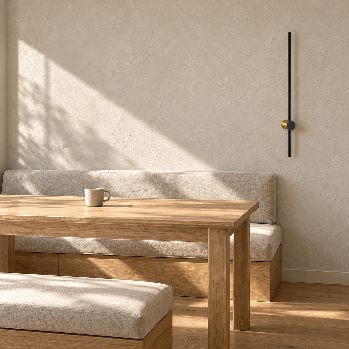 Semarlo black and gold wall sconce switched off in a breakfast nook under direct daylight