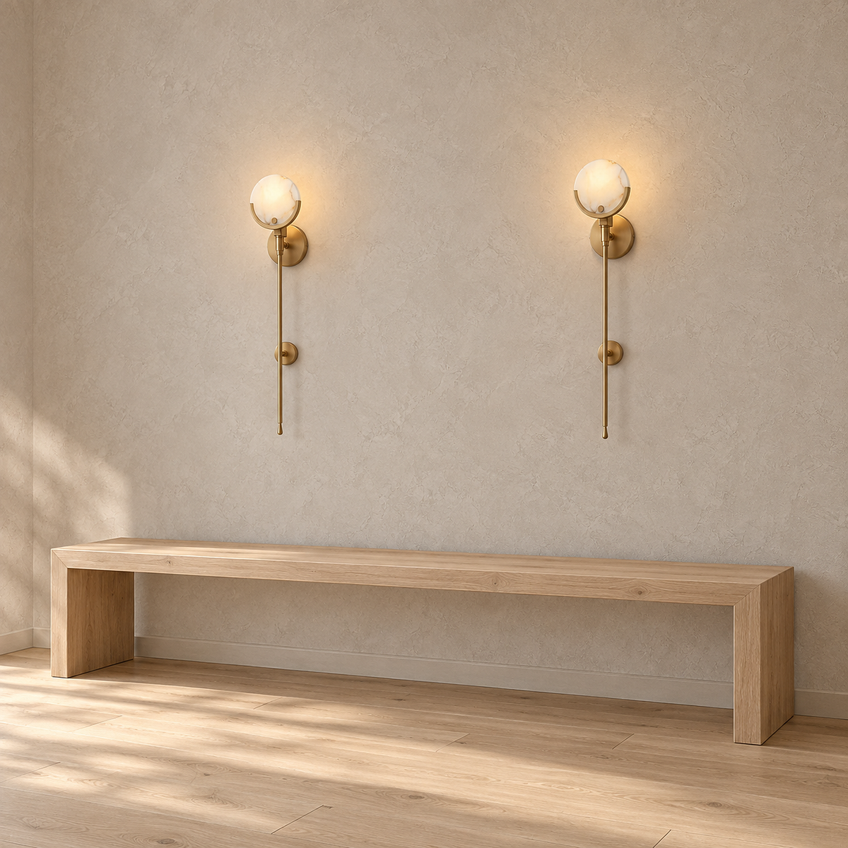 Serrinte brass wall sconce mounted on an entry vestibule wall, round top plate and smaller plate behind the stem