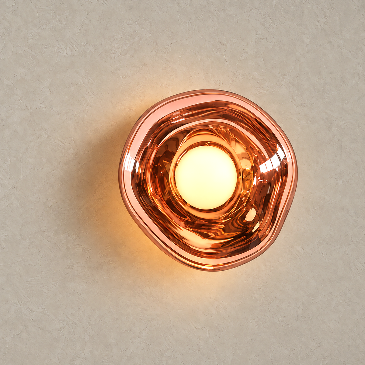 Sevalira rose gold bedside wall light lit against greige plaster with its shade aglow
