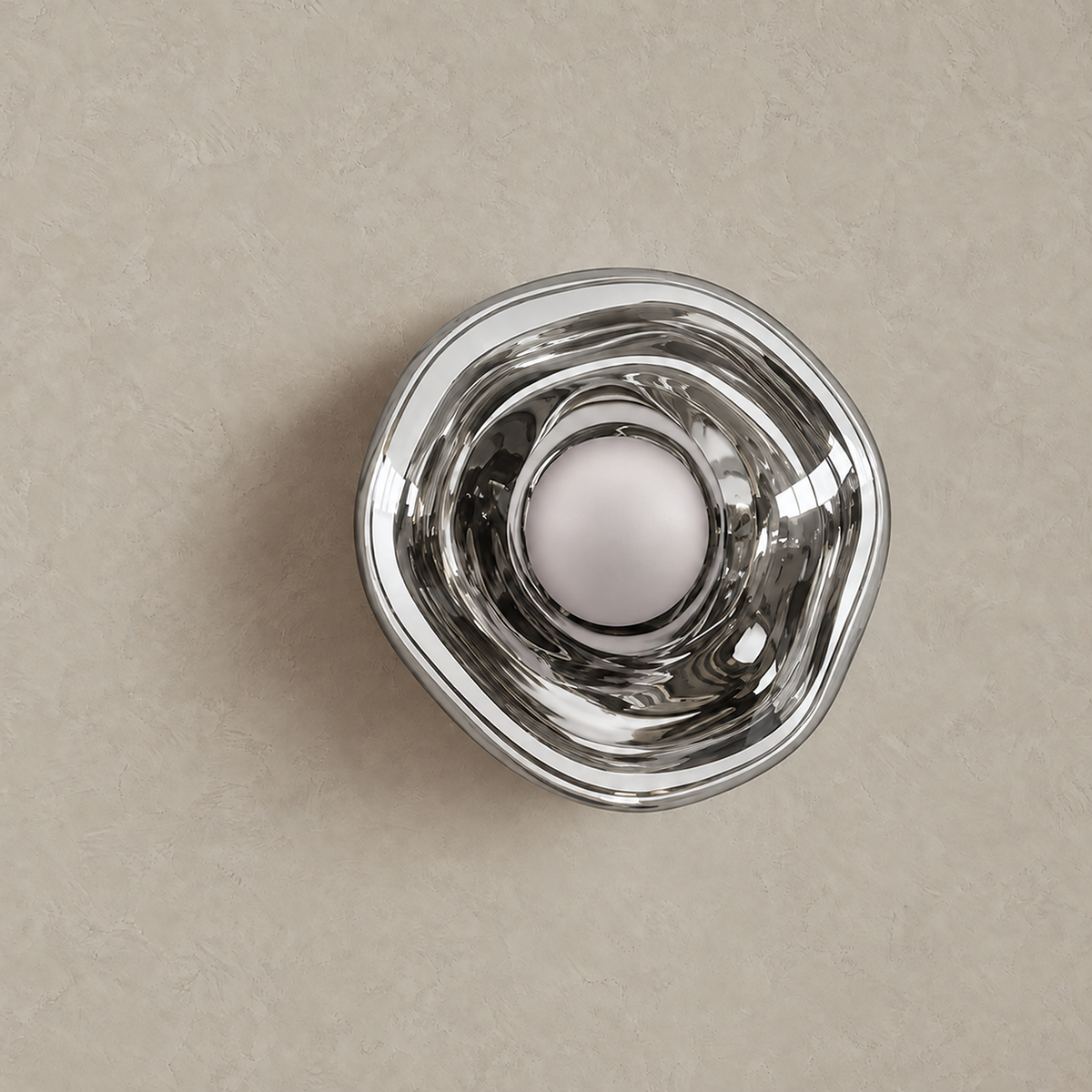 Sevalira silver bedside wall light unlit against a warm greige plaster backdrop #color_silver