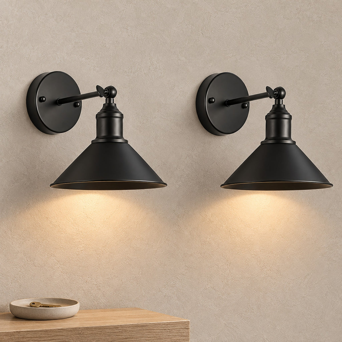 Sevarlo black wireless wall light pair glowing warm white in a bright entryway