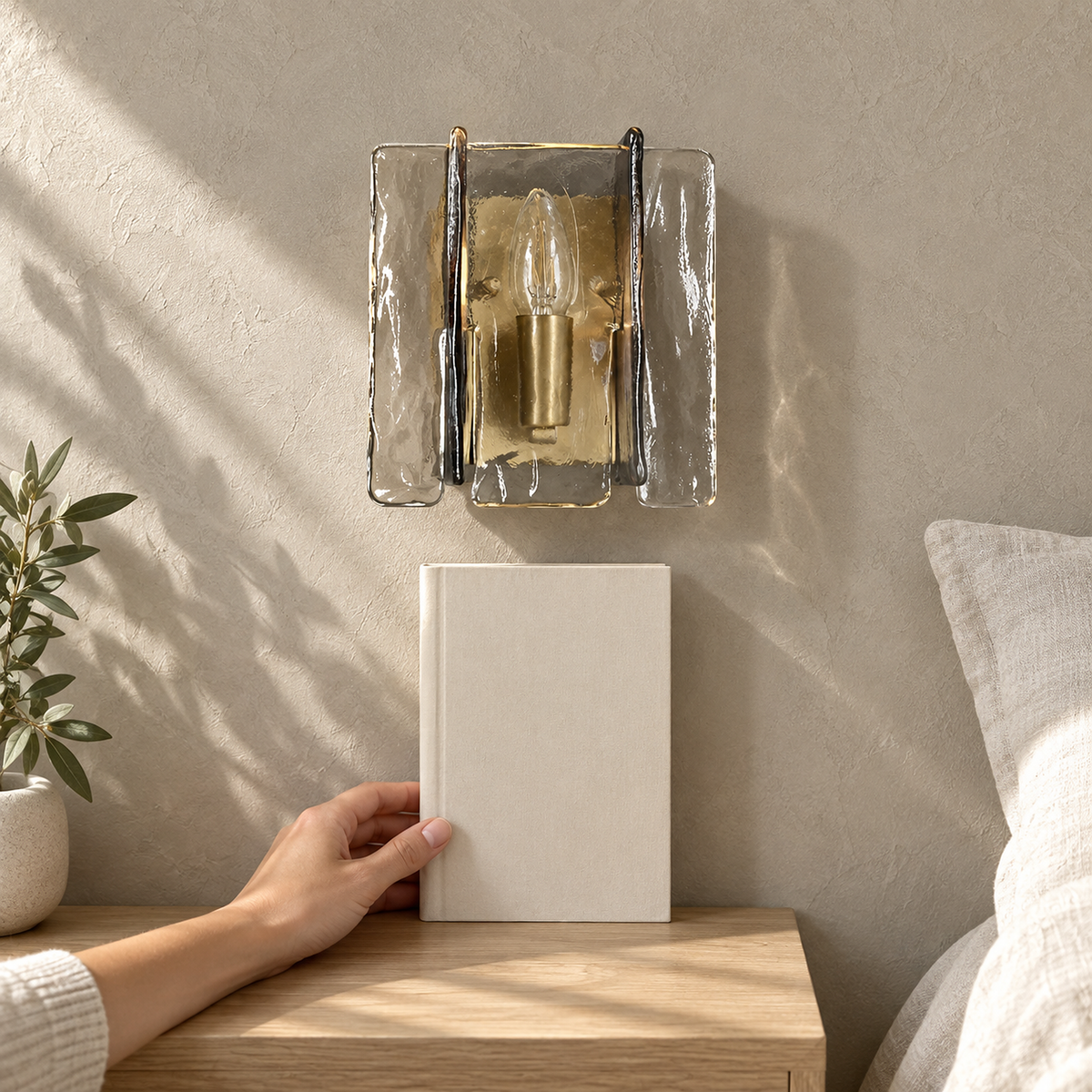 Simaelo black bedside wall light unlit above a book in bright direct sunlight