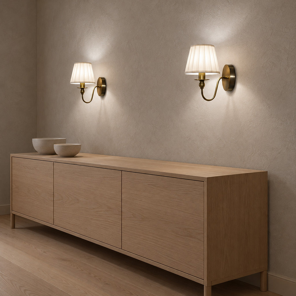Siralto gold battery operated wall sconce pair lit in a dining room in midday light
