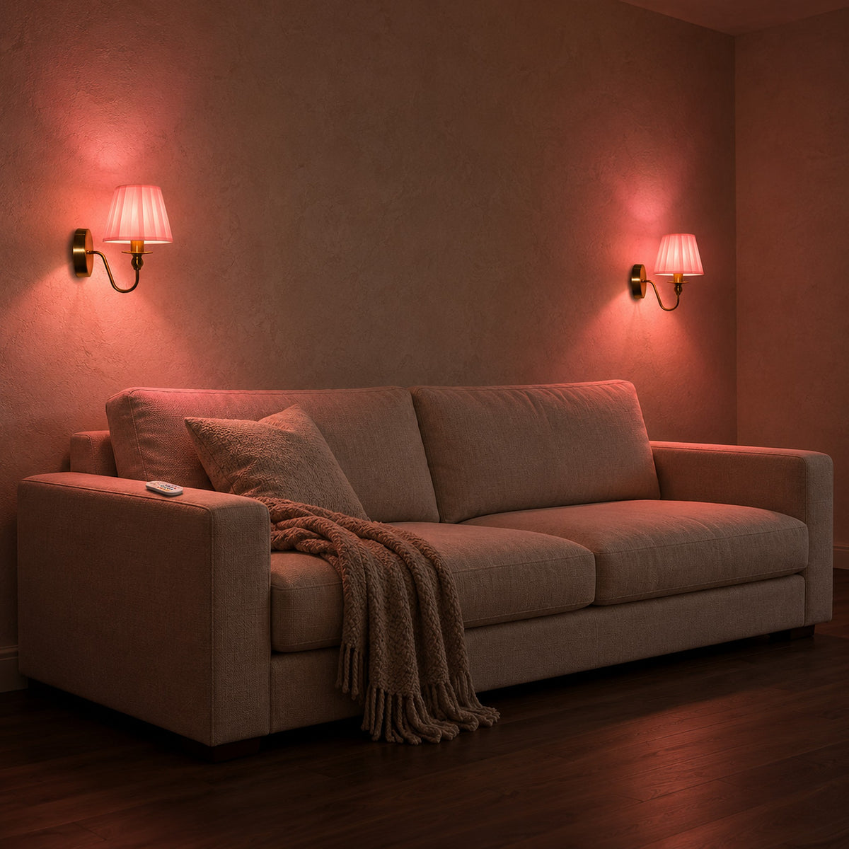 Siralto gold wireless wall light pair glowing rose above a living room sofa